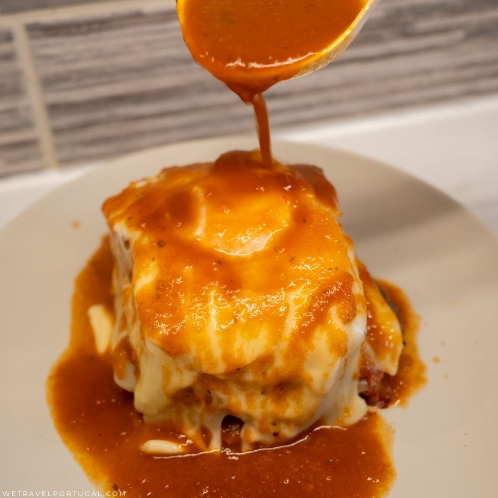 francesinha covered in sauce