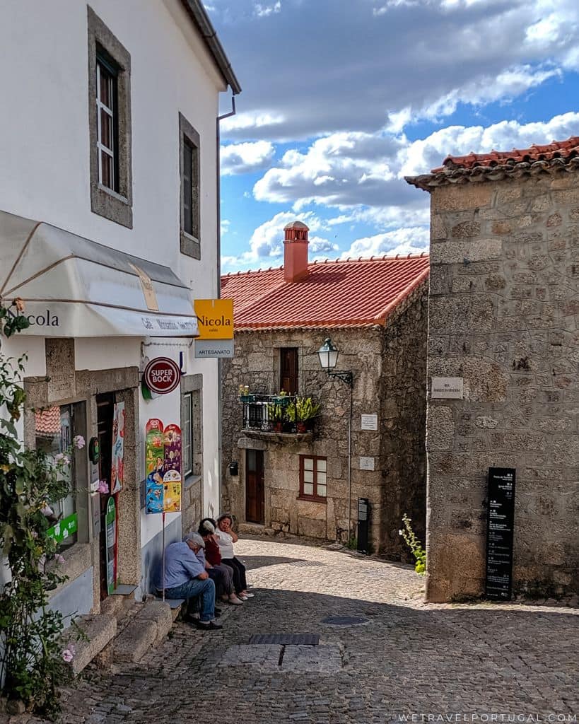 Villagers Outside a Cafe in Monsanto